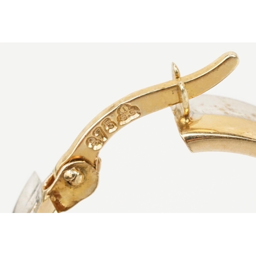 118 - Pair of 9ct gold two tone hoop earrings with hinged posts. Marked 375 to the posts. Measures 1.8cm d... 