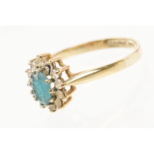 121 - Two hallmarked 9ct gold rings to include a blue topaz and cz cluster ring (hallmarked to shank), and... 