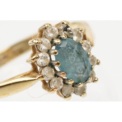 121 - Two hallmarked 9ct gold rings to include a blue topaz and cz cluster ring (hallmarked to shank), and... 