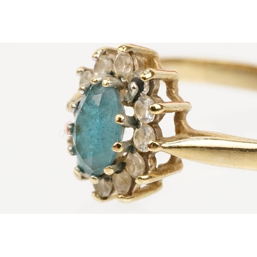 121 - Two hallmarked 9ct gold rings to include a blue topaz and cz cluster ring (hallmarked to shank), and... 