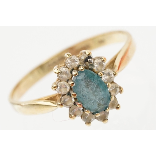 121 - Two hallmarked 9ct gold rings to include a blue topaz and cz cluster ring (hallmarked to shank), and... 