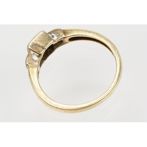 126 - 9ct gold and diamond ring. The ring being set with four princess cut diamonds to the head and two fu... 