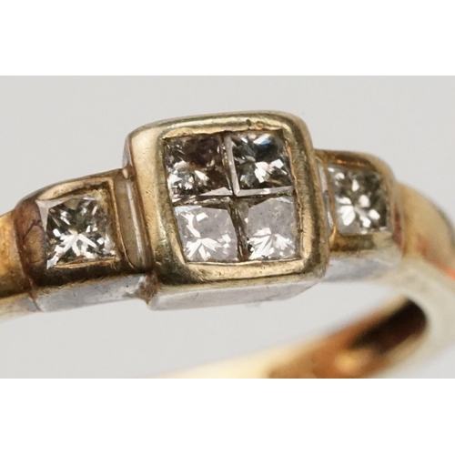 126 - 9ct gold and diamond ring. The ring being set with four princess cut diamonds to the head and two fu... 