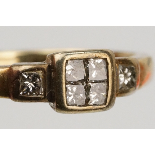 126 - 9ct gold and diamond ring. The ring being set with four princess cut diamonds to the head and two fu... 