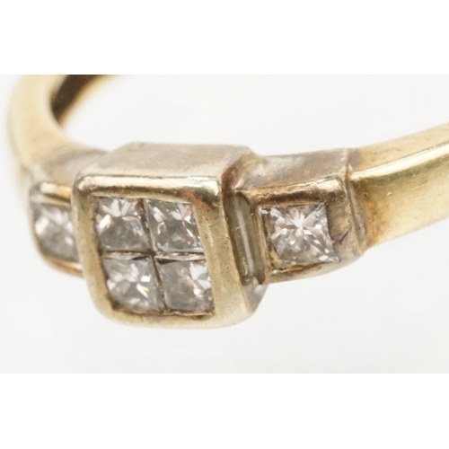 126 - 9ct gold and diamond ring. The ring being set with four princess cut diamonds to the head and two fu... 