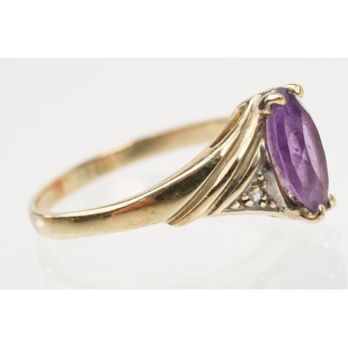 129 - Two 9ct gold hallmarked rings to include a marquise cut amethyst ring (hallmarked London 1991, size ... 