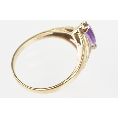 129 - Two 9ct gold hallmarked rings to include a marquise cut amethyst ring (hallmarked London 1991, size ... 