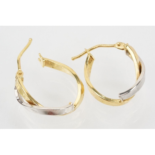 133 - Three pairs of hoop earrings to include a pair of 9ct  two tone cross over earrings (marked 375 to p... 