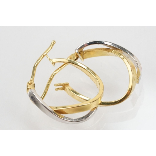 133 - Three pairs of hoop earrings to include a pair of 9ct  two tone cross over earrings (marked 375 to p... 