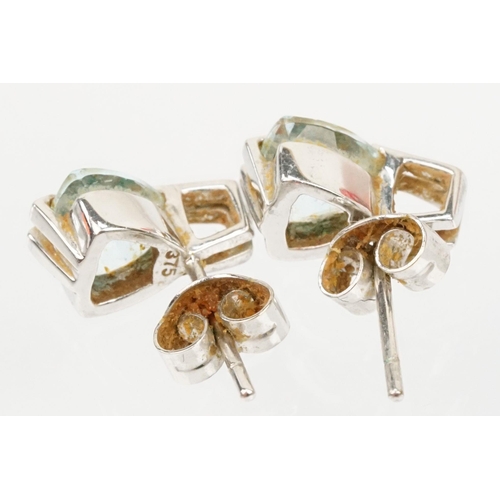 137 - Two pairs of 9ct gold earrings to include a pair of white gold and topaz earrings (marked 375) and a... 