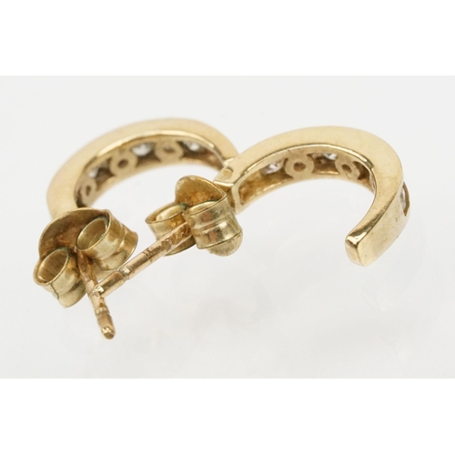 137 - Two pairs of 9ct gold earrings to include a pair of white gold and topaz earrings (marked 375) and a... 