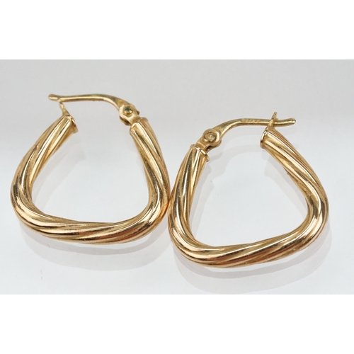 141 - Four pairs of 9ct gold hoop earrings to include a large pair of reeded hoops (hallmarked to posts), ... 