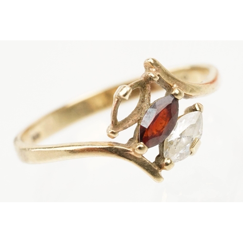 151 - 9ct gold ring set with a marquise cut garnet to centre and marquise cut white stone (one missing, si... 