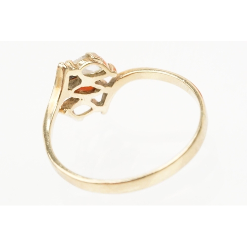 151 - 9ct gold ring set with a marquise cut garnet to centre and marquise cut white stone (one missing, si... 