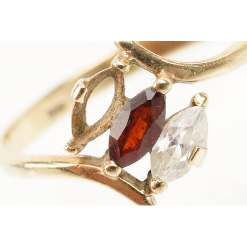 151 - 9ct gold ring set with a marquise cut garnet to centre and marquise cut white stone (one missing, si... 