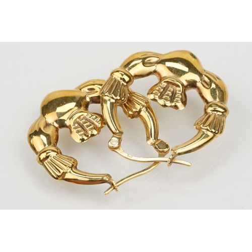 178 - Two pairs of 9ct gold Claddagh design hoop earrings with hinged posts. Both marked 375. Measures 2.5... 