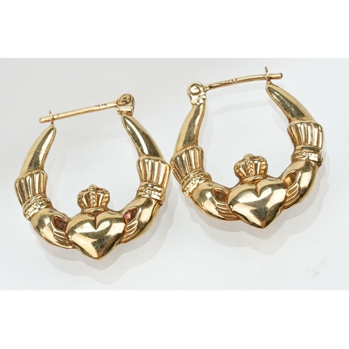 178 - Two pairs of 9ct gold Claddagh design hoop earrings with hinged posts. Both marked 375. Measures 2.5... 