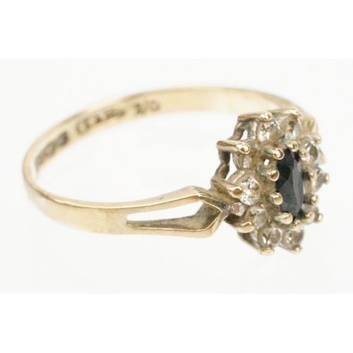 179 - 9ct gold sapphire and cz cluster ring having a marquise cut sapphire to centre surrounded by CZ's wi... 