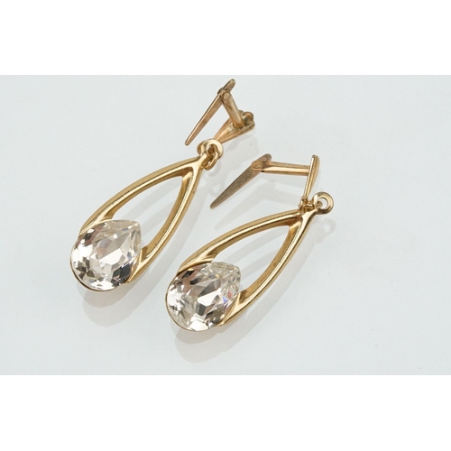 180 - Two 9ct gold jewellery suites to include a pair of drop earrings and matching pendant set with pear ... 