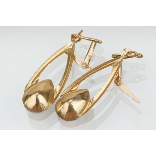 180 - Two 9ct gold jewellery suites to include a pair of drop earrings and matching pendant set with pear ... 