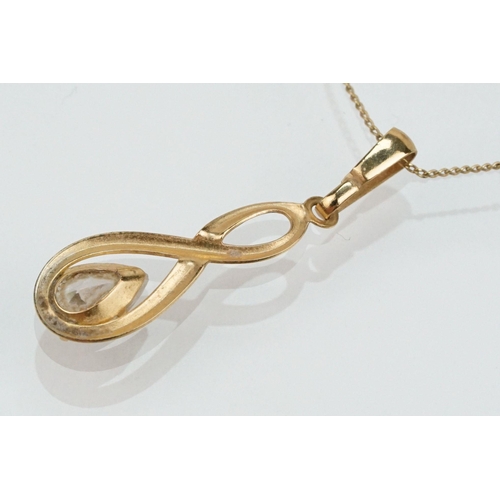 180 - Two 9ct gold jewellery suites to include a pair of drop earrings and matching pendant set with pear ... 