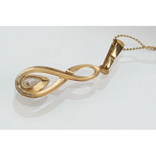 180 - Two 9ct gold jewellery suites to include a pair of drop earrings and matching pendant set with pear ... 