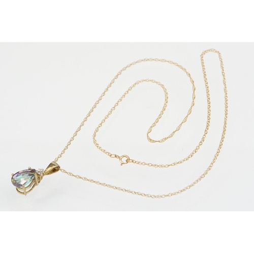 181 - Two 9ct gold pendant necklaces to include a mystic topaz set pendant on a fine link chain and a lyre... 