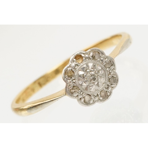 199 - 18ct gold and platinum daisy ring. The ring set with diamond accent stones to the head. Marked 18ct ... 