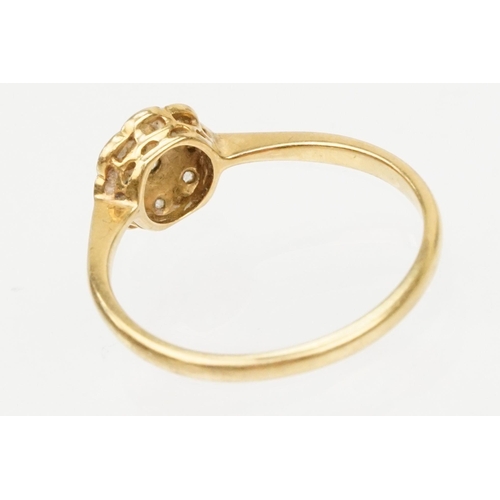 199 - 18ct gold and platinum daisy ring. The ring set with diamond accent stones to the head. Marked 18ct ... 