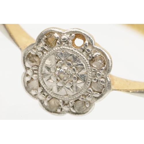 199 - 18ct gold and platinum daisy ring. The ring set with diamond accent stones to the head. Marked 18ct ... 