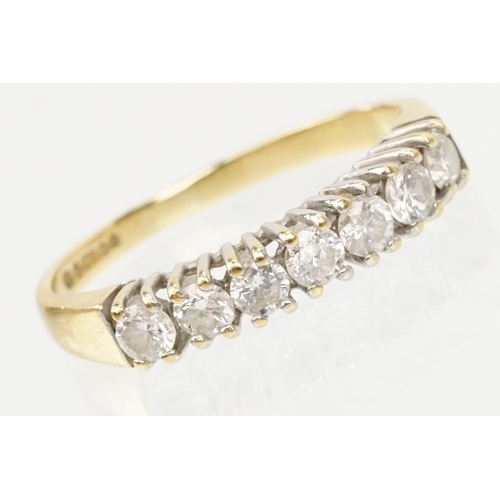 25 - 18ct gold and diamond seven stone ring. The ring being set with seven round brilliant cut diamonds i... 