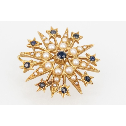 32 - 14ct gold, sapphire and pearl star brooch set with nine round cut sapphires and graduating half pear... 