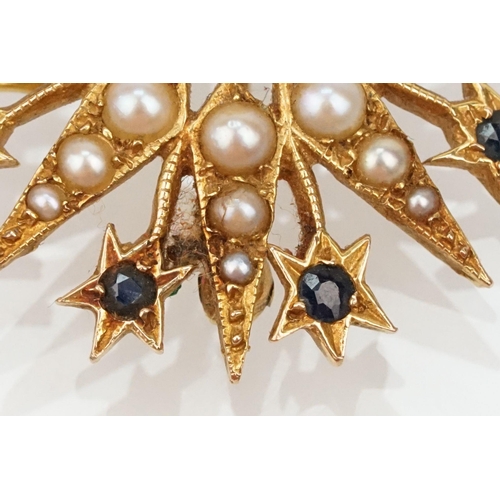 32 - 14ct gold, sapphire and pearl star brooch set with nine round cut sapphires and graduating half pear... 