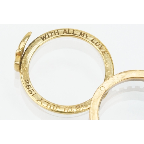 36 - 18ct gold tri tone ring constructed from three interlocking rings with clasped hands to the head, op... 