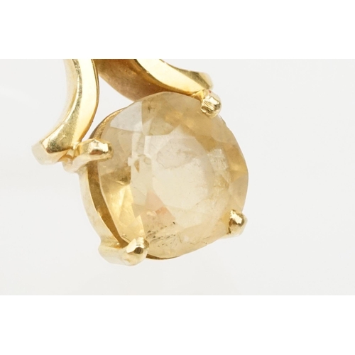 38 - 18ct gold and citrine ring. The ring being set with a cushion cut citrine on scrolled shoulders. Mar... 