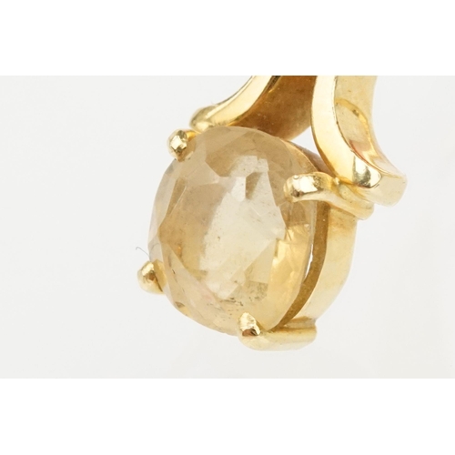 38 - 18ct gold and citrine ring. The ring being set with a cushion cut citrine on scrolled shoulders. Mar... 