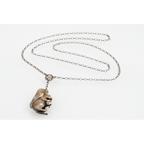 44 - Silver Carol Mather pendant necklace. The necklace having an enamelled squirrel pendant with oval li... 