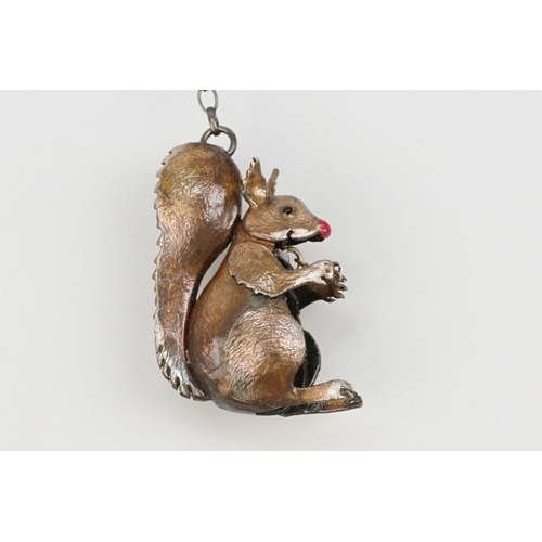 44 - Silver Carol Mather pendant necklace. The necklace having an enamelled squirrel pendant with oval li... 