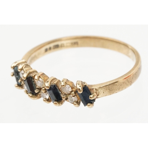 46 - 9ct gold sapphire and diamond ring. The ring being set with four step cut sapphires and six round br... 