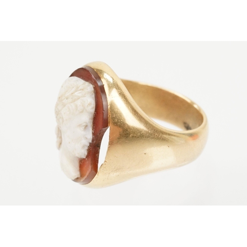 48 - 19th Century gold and carved agate cameo ring. The ring being set with an oval hand carved male came... 