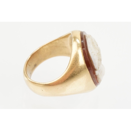 48 - 19th Century gold and carved agate cameo ring. The ring being set with an oval hand carved male came... 