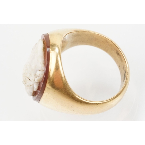 48 - 19th Century gold and carved agate cameo ring. The ring being set with an oval hand carved male came... 