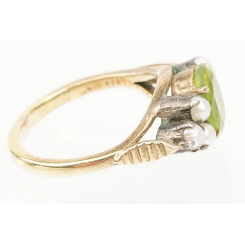 52 - Peridot and pearl dress ring. The ring being set with an oval cut peridot to centre flanked by six s... 