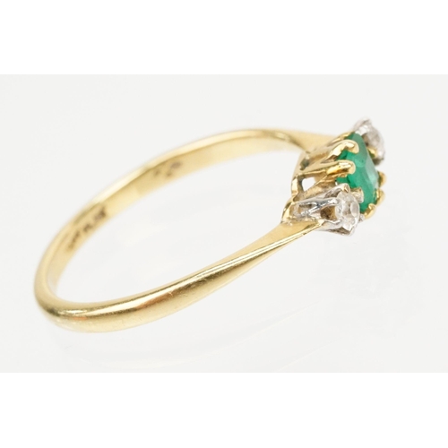 64 - 18ct gold diamond and emerald three stone ring. The ring being set with a square step cut emerald fl... 