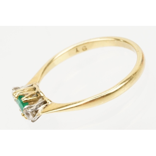 64 - 18ct gold diamond and emerald three stone ring. The ring being set with a square step cut emerald fl... 