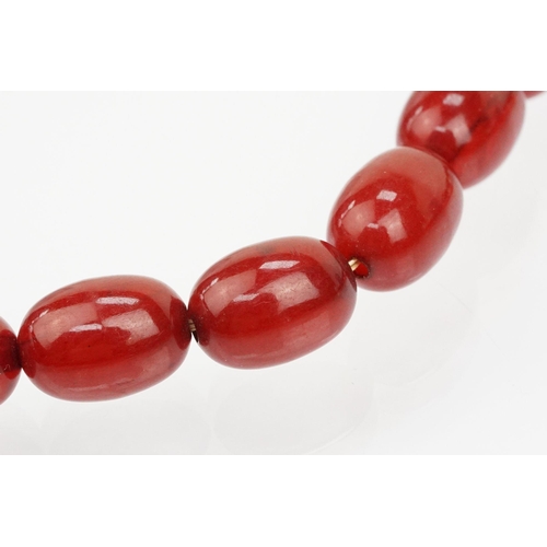 69 - 1930s bakelite necklace strung with graduating oval cherry bakelite beads. Largest ad measures 2.8cm... 