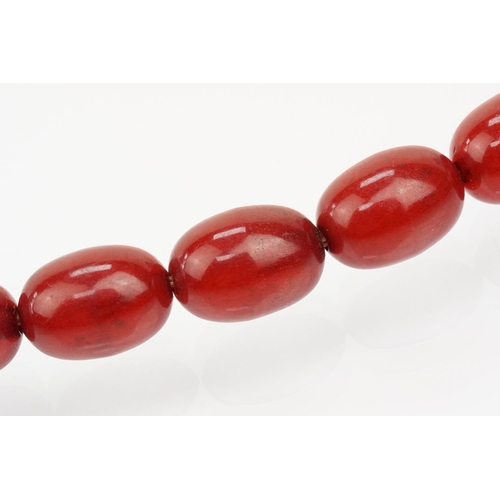 69 - 1930s bakelite necklace strung with graduating oval cherry bakelite beads. Largest ad measures 2.8cm... 