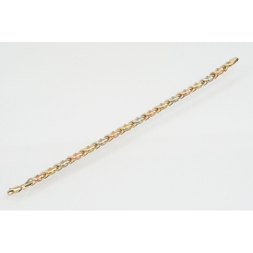 71 - 9ct gold tri tone cross over link bracelet with a lobster clasp. Hallmarked Sheffield to jump link. ... 