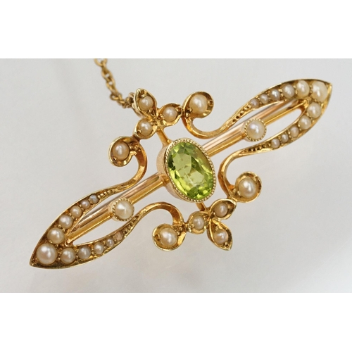 75 - Edwardian 15ct gold, peridot and a seedpearl brooch having an oval cut peridot to the centre with ha... 