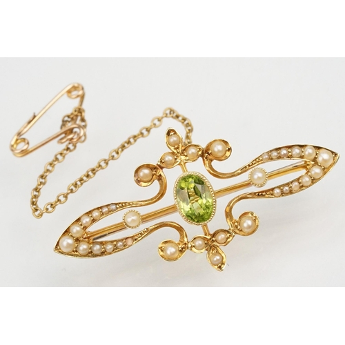 75 - Edwardian 15ct gold, peridot and a seedpearl brooch having an oval cut peridot to the centre with ha... 